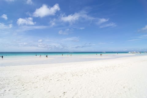 On the beach, white sand, beach shuttle, beach towels