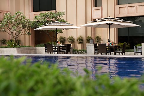 Outdoor pool, open 6:30 AM to 10:00 PM, pool umbrellas, sun loungers