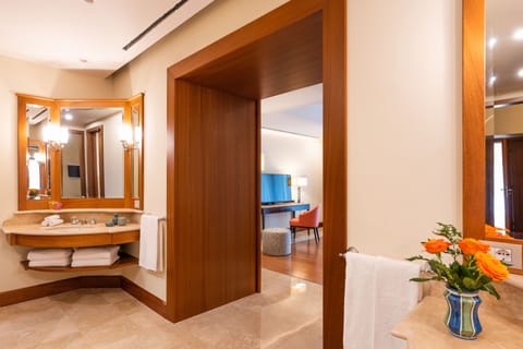 Premium Suite | Bathroom | Combined shower/tub, deep soaking tub, rainfall showerhead