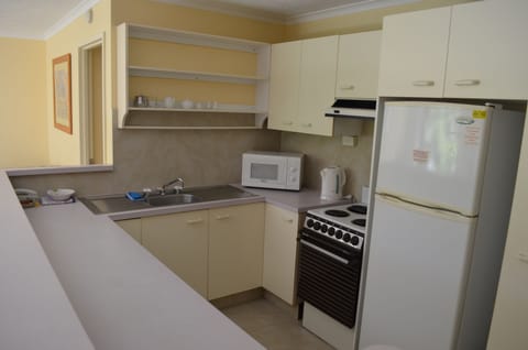 Apartment, 2 Bedrooms | Private kitchen | Fridge, microwave, coffee/tea maker, electric kettle