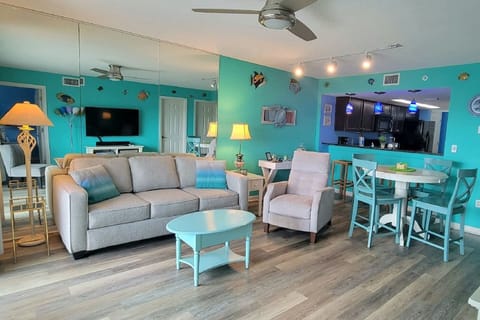 living space with 4K 55" Roku TV and queen pull-out sofa bed