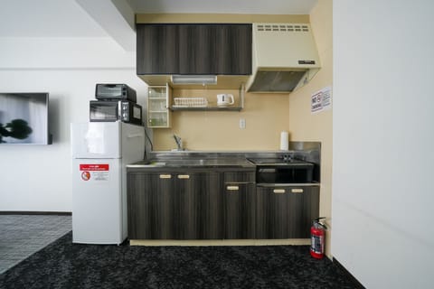 Comfort Apartment, Non Smoking (603) | Private kitchen | Full-size fridge, microwave, stovetop, toaster