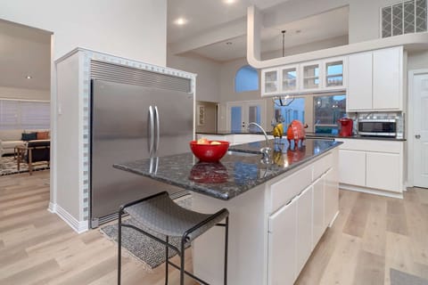 Fully stocked kitchen with granite and stainless steel appliances