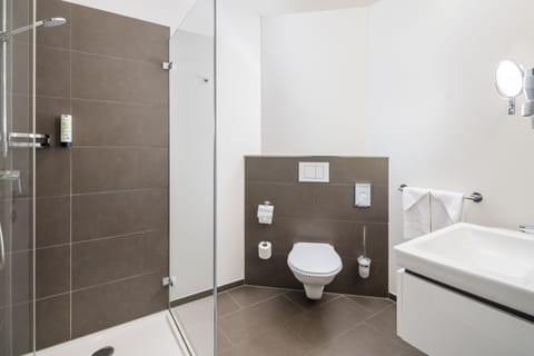 Shower, eco-friendly toiletries, hair dryer, towels