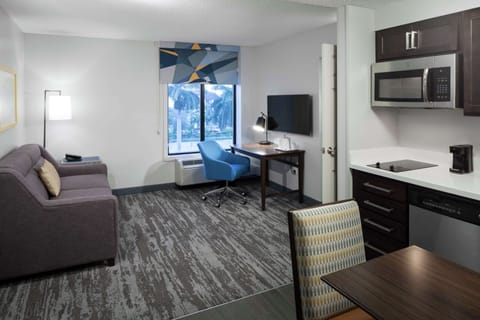 One Bedroom King Suite | In-room safe, desk, laptop workspace, blackout drapes