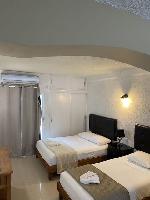 Standard Room, Multiple Beds, Non Smoking, Balcony | Free WiFi, bed sheets