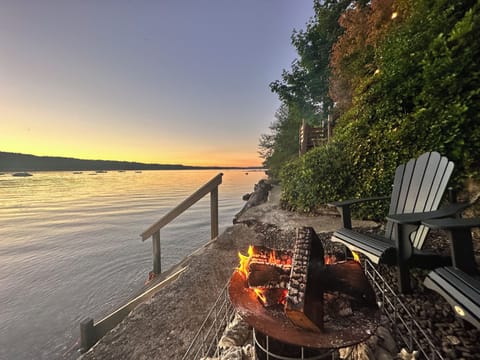 Watch sunsets on the bulkhead right next to the beach while enjoying a fire