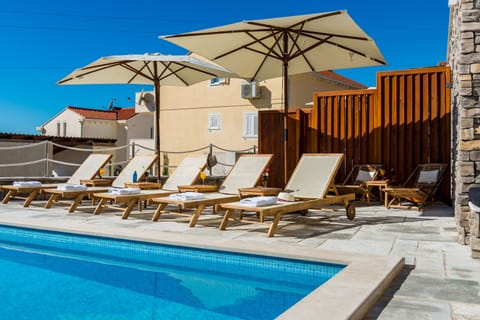 Seasonal outdoor pool, pool umbrellas, sun loungers