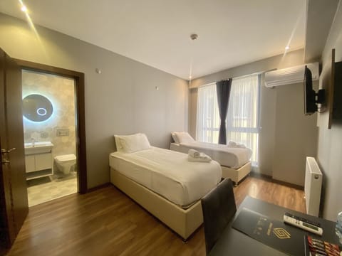 Family Suite, 2 Bedrooms, Non Smoking, City View | Minibar, desk, laptop workspace, blackout drapes