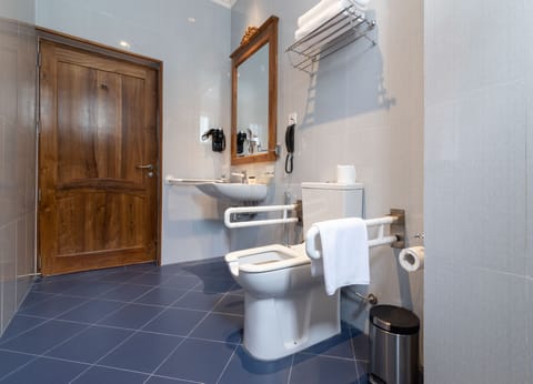 Quadruple Room | Bathroom | Rainfall showerhead, designer toiletries, hair dryer, bathrobes
