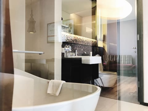 Executive Suite, 1 King Bed | Bathroom | Shower, eco-friendly toiletries, hair dryer, bathrobes