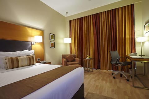 Deluxe Room, Non Smoking, City View | Premium bedding, minibar, in-room safe, desk