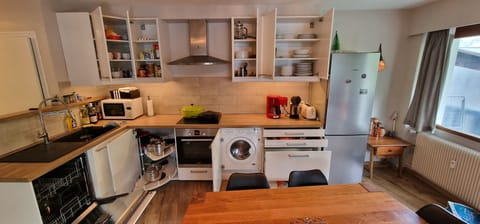 large kitchen in full display, all amenities available to host up to 6 persons