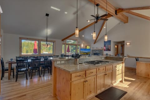- Kitchen island with barstool seating
- Granite counters and pendant lighting
- Tahoe cabin rental with chef-style kitchen