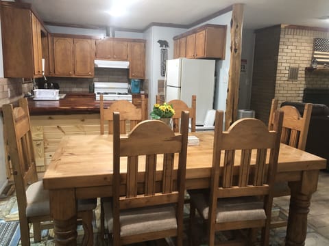 The table seats 6, but extra folding chairs are available. 