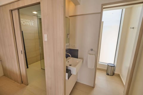 Premier Room - 2 Queen Beds | Bathroom | Shower, free toiletries, hair dryer, slippers