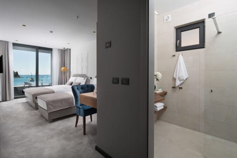 Superior Triple Room, Balcony, Sea View | Living area | Flat-screen TV