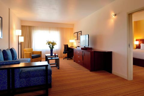 Suite, 1 King Bed | Living area | 42-inch LCD TV with cable channels, Smart TV, Netflix