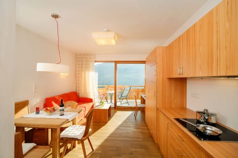 Superior Apartment | Living area | 80-cm LCD TV with satellite channels, TV, heated floors