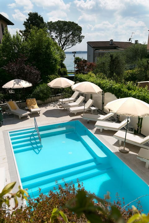 Seasonal outdoor pool, pool umbrellas, sun loungers