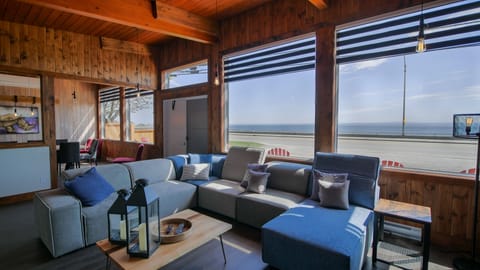 Superior Chalet, 4 Bedrooms, Sea View | Living room | Flat-screen TV