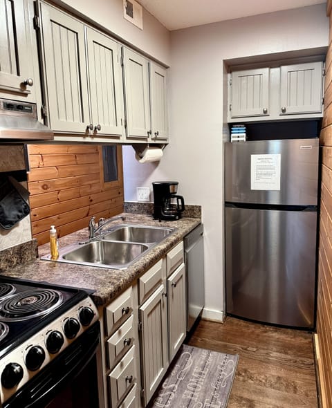 Compact well stocked kitchen.