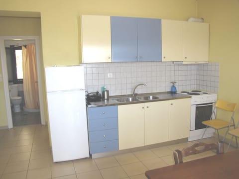 Apartment, 2 Bedrooms, Sea View | Private kitchen | Full-size fridge, stovetop, coffee/tea maker, electric kettle