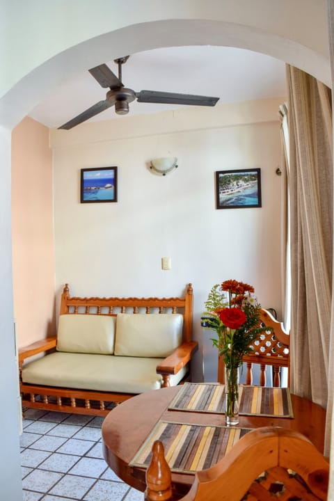 Junior Studio Suite, 2 Double Beds | Living area | 24-inch LED TV with cable channels, TV, books