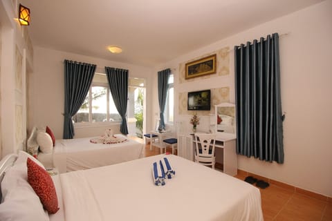 Family Quadruple Room, Beach View, Beachfront | Minibar, in-room safe, blackout drapes, soundproofing