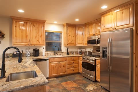 Kitchen fully equipped with stainless steel appliances
