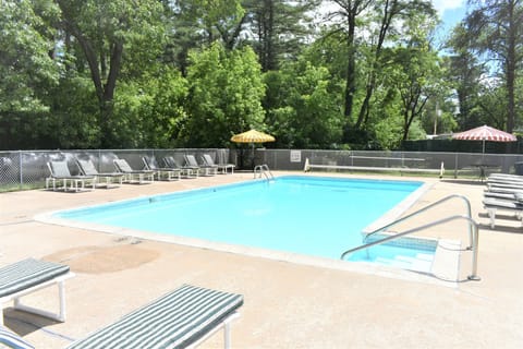 Seasonal outdoor pool, open 10:30 AM to 10:00 PM, pool umbrellas