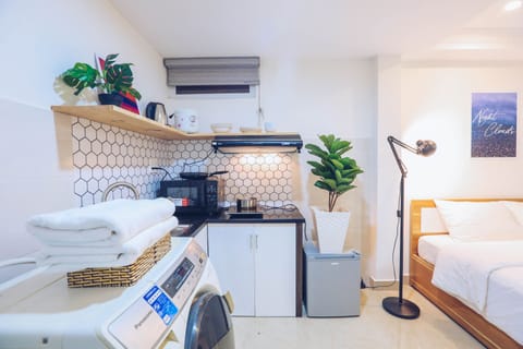 Standard Quadruple Room | Living area | Flat-screen TV