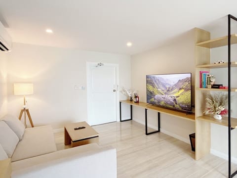 Two-Bedroom Suite | Living area | 32-inch flat-screen TV with cable channels, TV