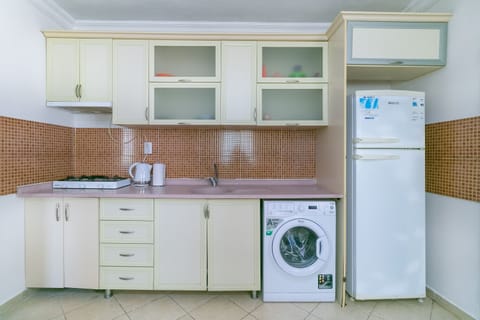 Villa | Private kitchen | Fridge, electric kettle, cookware/dishes/utensils