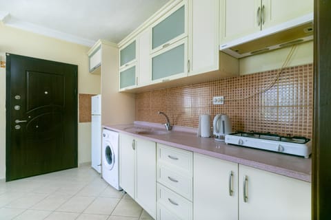 Villa | Private kitchen | Fridge, electric kettle, cookware/dishes/utensils