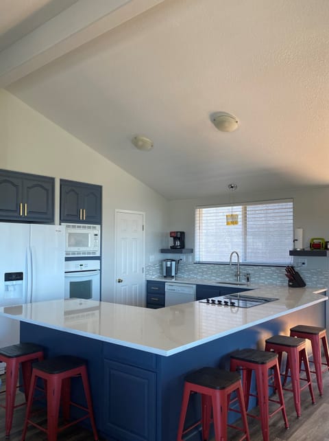 Kitchen designed to encourage guests to gather and enjoy each other’s company.