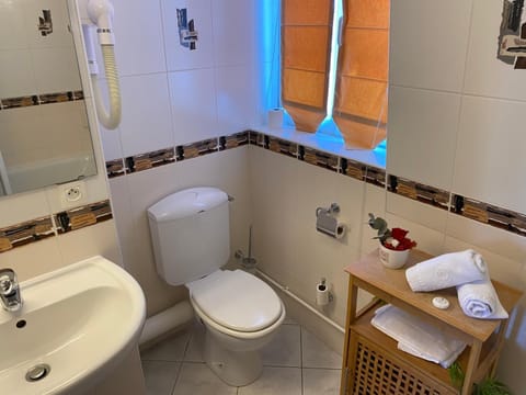 Hair dryer, slippers, towels, soap