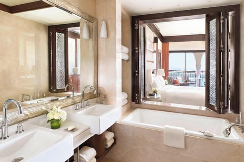 Separate tub and shower, designer toiletries, hair dryer, bathrobes