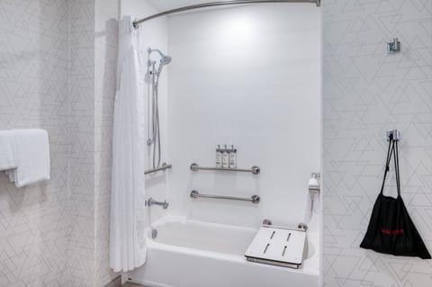 Suite, 1 King Bed, Accessible (Accessible Tub) | Bathroom | Hair dryer, towels, soap, shampoo