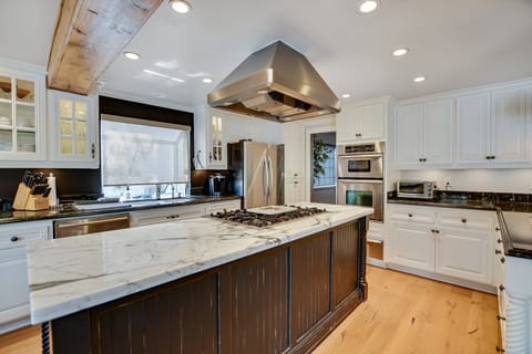 The kitchen with island for cooking.