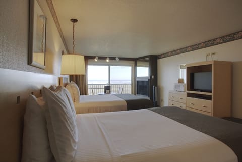 Room, 2 Queen Beds, Ocean View | Living area | 32-inch TV with cable channels, DVD player