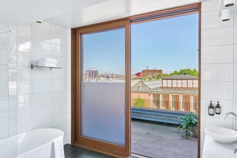 The Terrace Suite | Bathroom | Designer toiletries, hair dryer, heated floors, towels