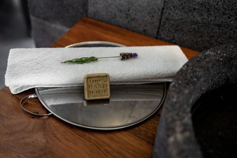 Designer toiletries, towels, soap, shampoo