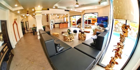 Luxury Villa | Living area | 32-inch TV with satellite channels