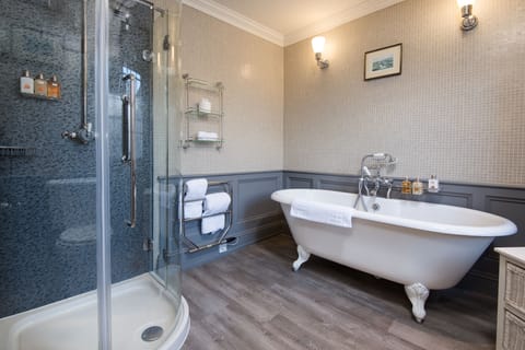 Designer toiletries, hair dryer, slippers, towels