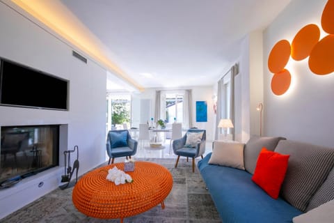 Family Villa, Multiple Bedrooms, Sea Facing (Villa Victor 100m from sea) | Living area | 21-inch flat-screen TV with digital channels, TV, fireplace