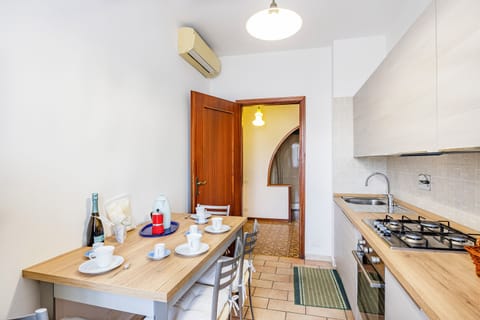 Family Apartment, 1 Bedroom (Casa Arno 500m from beach) | Private kitchen | Full-size fridge, microwave, oven, stovetop
