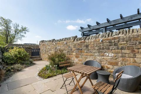 Sunny patio with outdoor furniture.