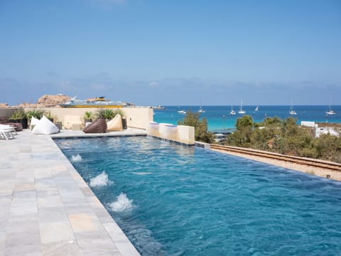 Outdoor pool, pool umbrellas, sun loungers