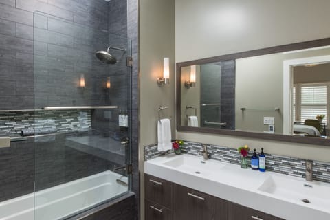 Upper View King Room | Bathroom | Combined shower/tub, deep soaking tub, designer toiletries, hair dryer